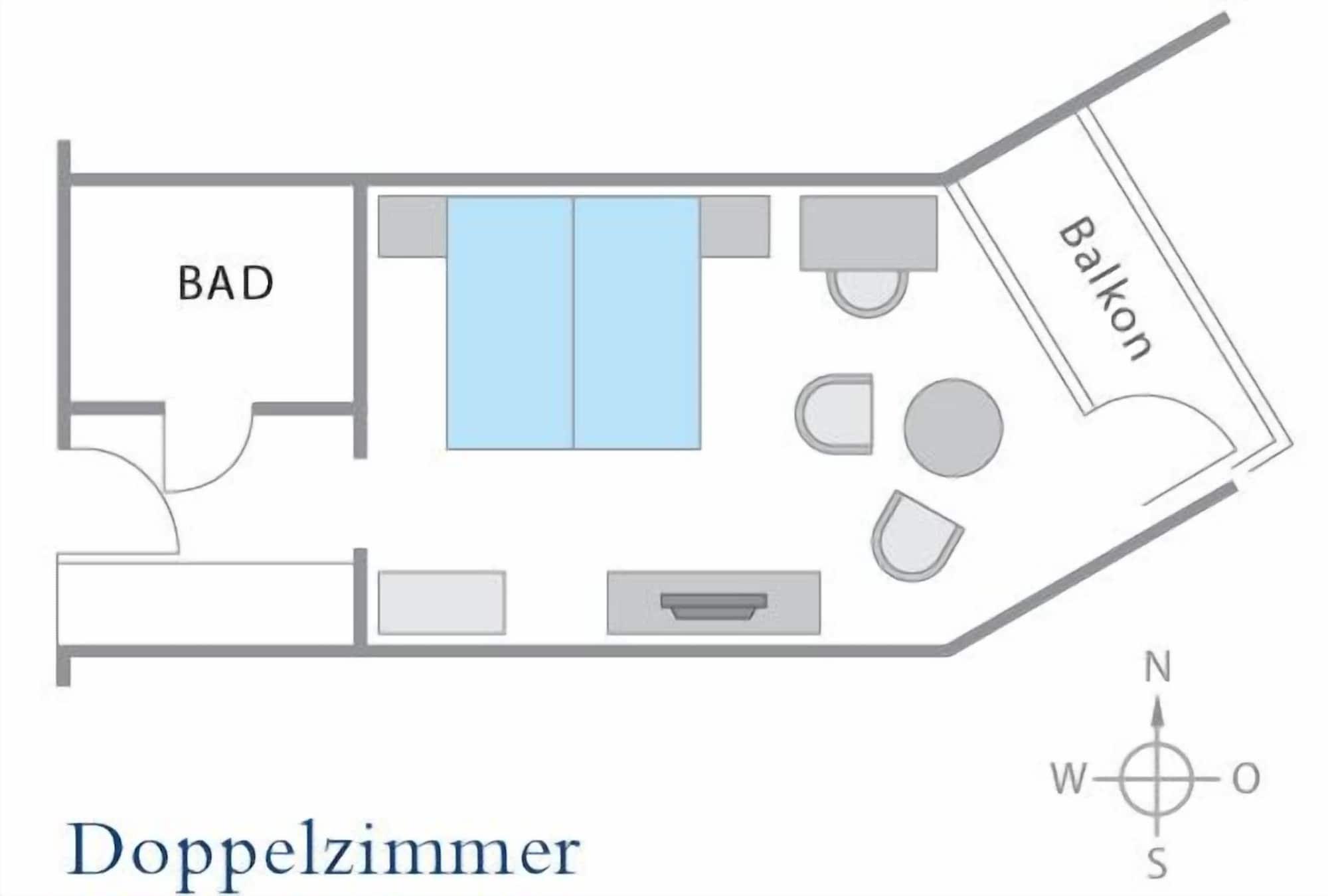 Hotel Neptun Rostock Exterior photo The image shows a floor plan for a double room, labeled "Doppelzimmer." The layout includes:

- A bedroom area featuring two beds (depicted in blue).
- A small seating area with two chairs and a table.
- A bathroom area labeled "BAD."
- A balcony are